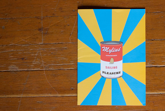 Mylius brochure cover showing a can reminiscent of Andy Warhol's Campbell's Tomato Soup. It has the words 'Mylius' Condensed Sailing Pleasure' written on the label.