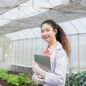 Plant scientist in greenhouse