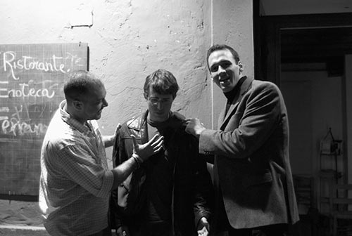 A picture of Donnie, Jimmy, and Vinciguerra in a piazza at Trastevere. Jimmy is in the middle and Donnie and Vinciguerra are trying to calm him down.