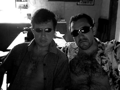 A picture of Jimmy and Montana in Jimmy's Bracciano HQ. They are wearing shades, and looking dangerous.